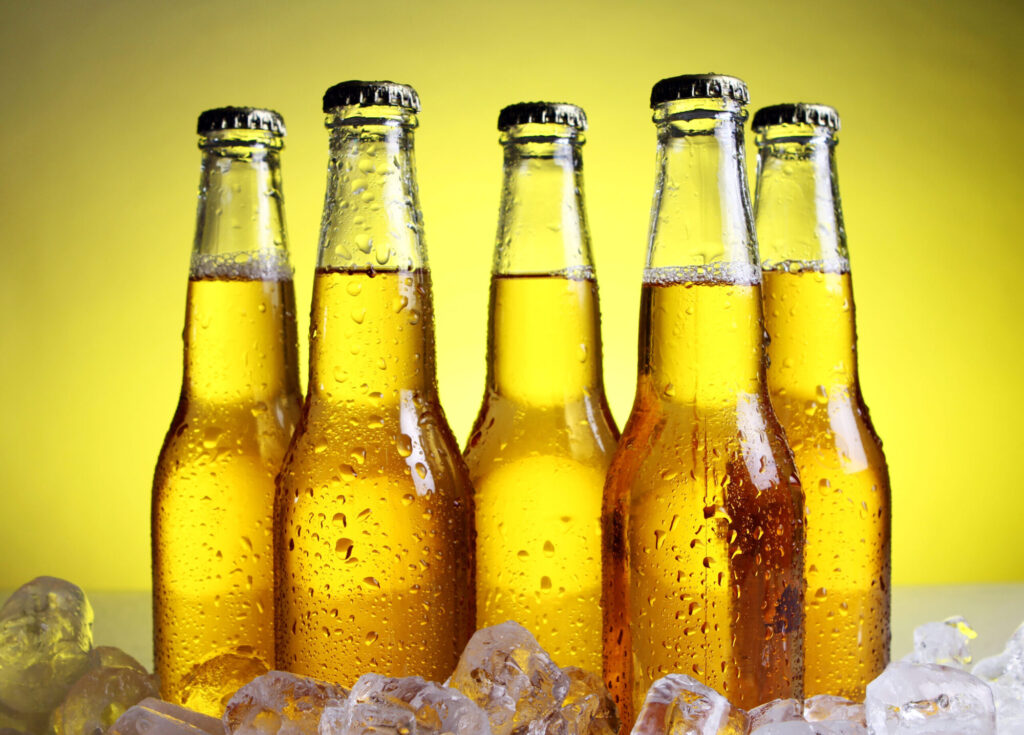 bottles-of-cold-and-fresh-beer-with-ice-2021-08-30-08-27-59-utc-scaled